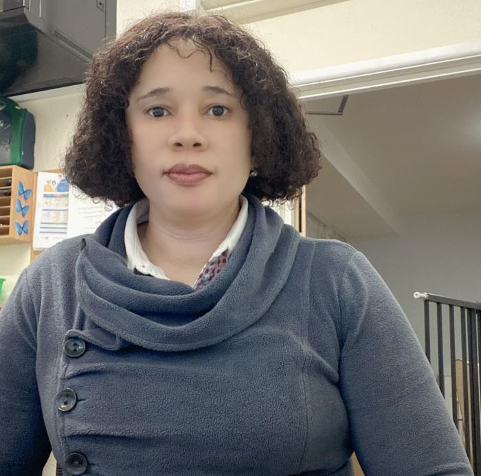 Photo shows lady in grey jumper 