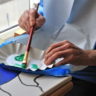 A person partaking in abstract painting